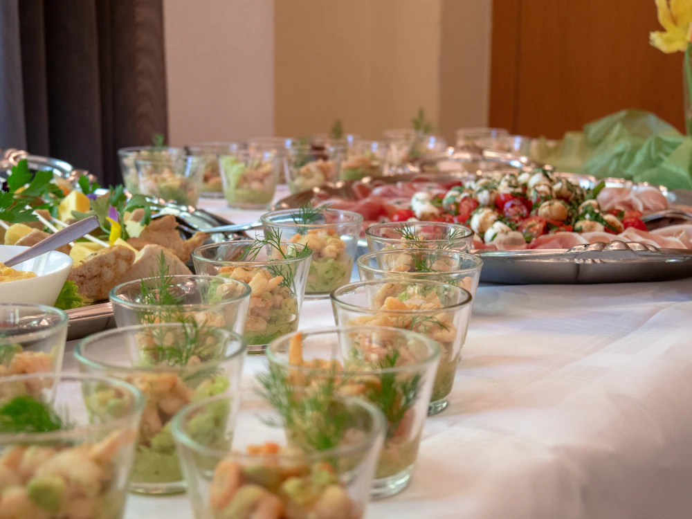 Canapés and glasses laid out on a table at a private party