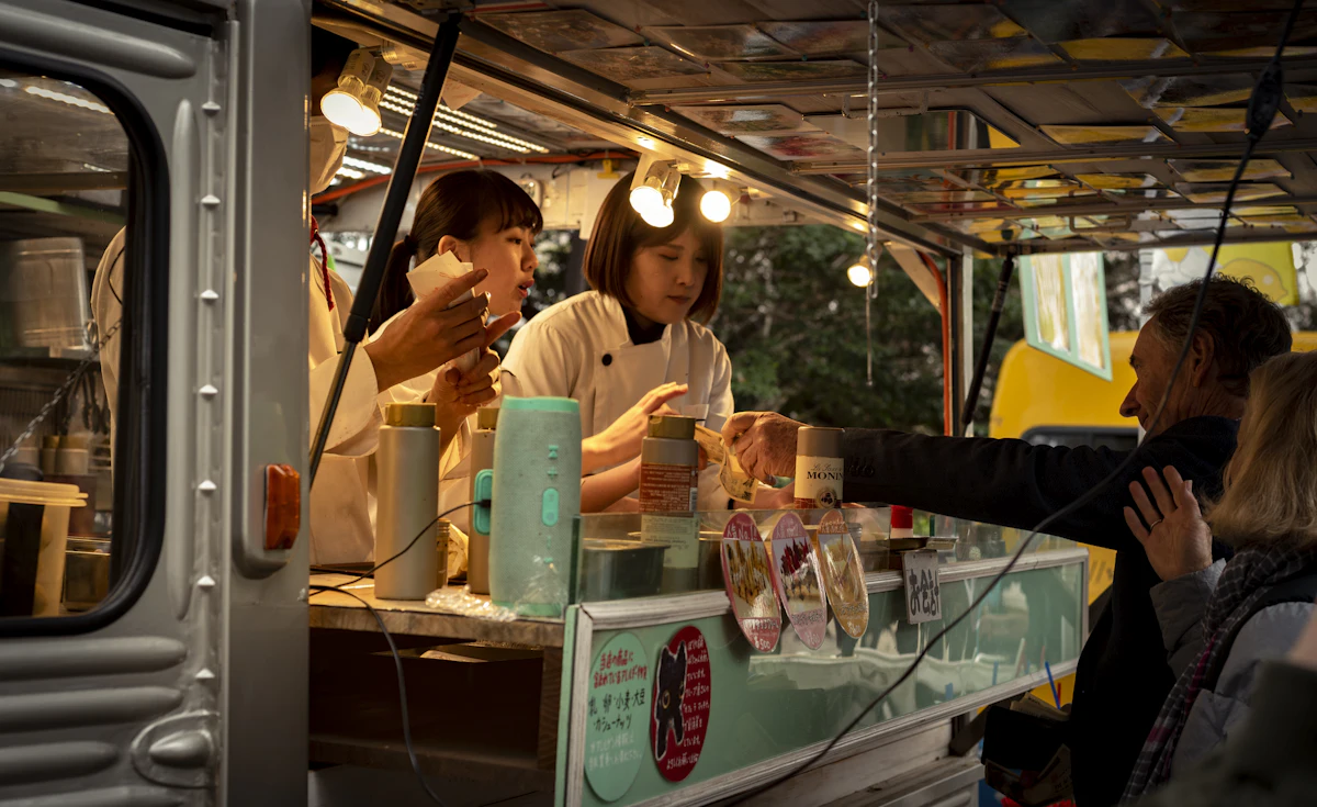 People queuing at a street food truck