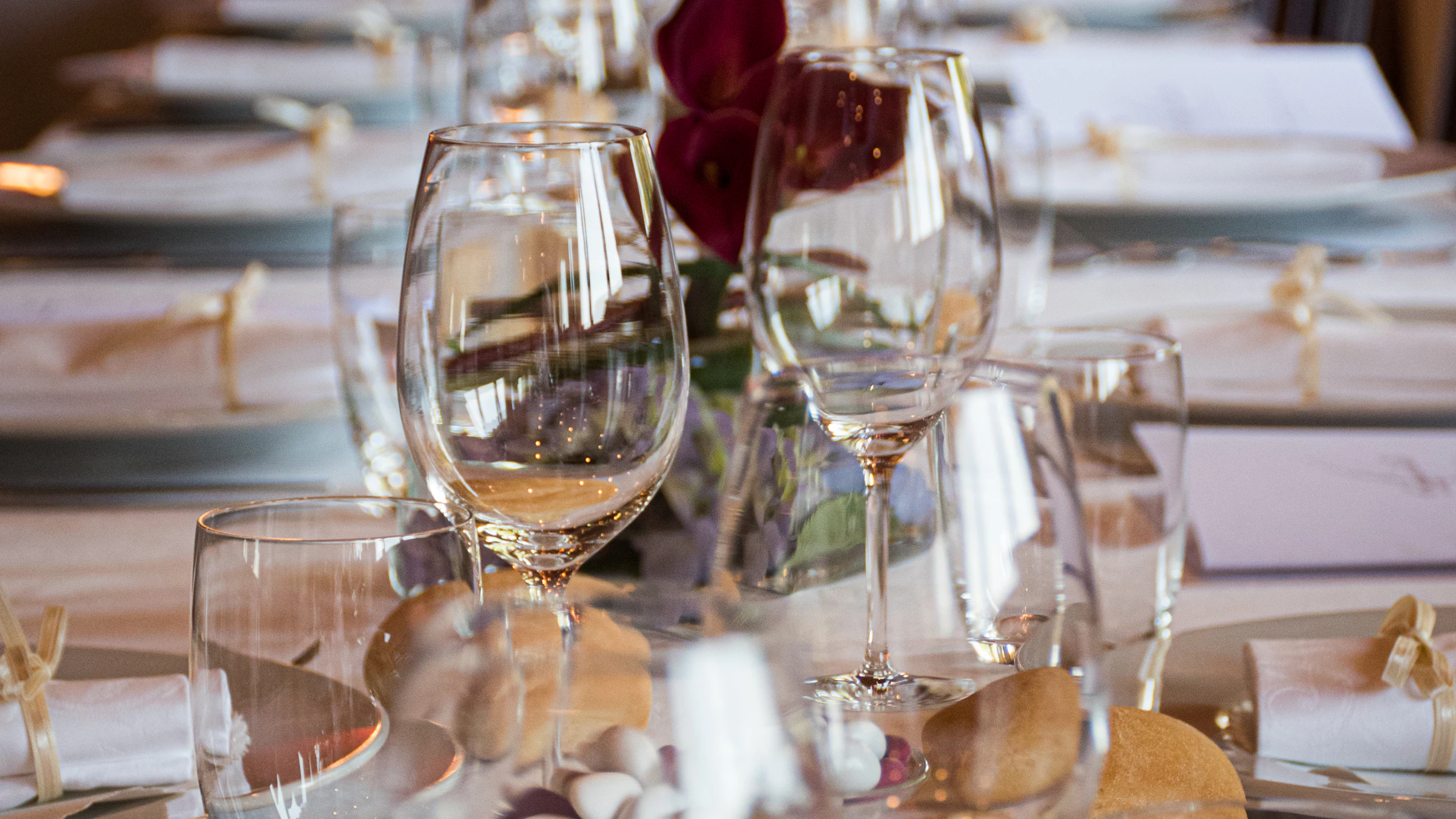 Candlelit tables laid for an evening reception