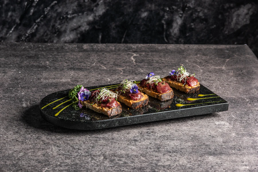Canapés plated on a dark slate board